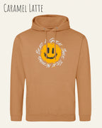 Das Bild zeigt den Unisex Hoodie JH001 von awdis in der Farbe caramel latte mit dem Design Nothing beats a great smile.