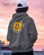 Mann trägt einen Heavyweight oversized Hoodie in powder grey mit dem Backprint Design Nothing beats a great smile today.