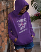 Eine Frau trägt den damen design hoodie JH001F von awdis in der Farbe purple mit dem STATEMENT Design THINK SPEAK ACT