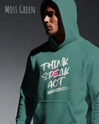 Mann trägt streetwear hoodie im oversize fit in farbe moss green mit think speak act motiv auf der Brust