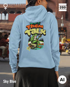 Das bild zeigt eine frau, die  einen Damen-Design-Hoodie in der farbe sky blue mit dem humorvollen backprint "let them talk" trägt.