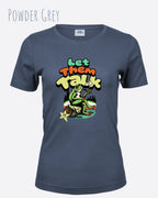 das bild zeigt das T-Shirt Tee Jays Women's Interlock Tee STYLE 580 in der farbe powder grey mit dem humorvollen design "LET THEM TALK".