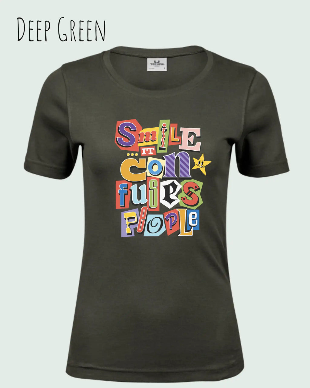 das bild zeigt das T-Shirt Tee Jays Women's Interlock Tee STYLE 580 in der farbe DEEP GREEN mit dem farbenfrohen design "SMILE ... IT CONFUSES PEOPLE".
