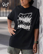 mann trägtt ein unisex oversized heavyweight t-shirt  mit dem design overthinking solves nothing.