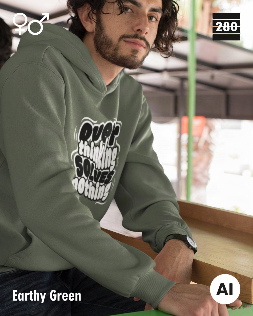 das bild zeigt eine person, die einen statement hoodie in der farbe earthy green und mit dem motiv "overthinking solves nothing" trägt.