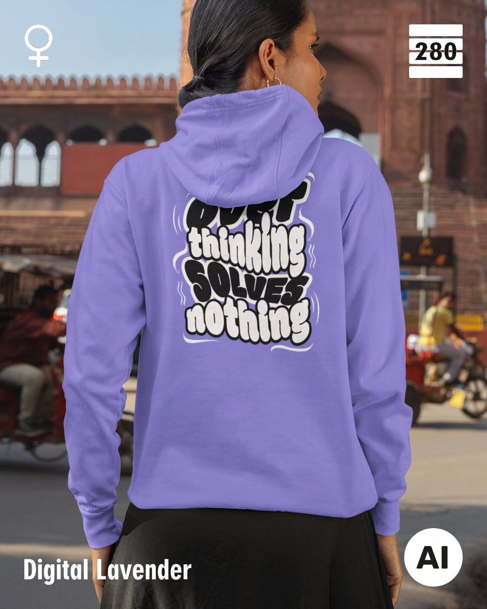 das bild zeigt eine frau, die einen leicht taillierten statement hoodie in der farbe digital lavender und mit dem motiv "overthinking solves nothing" trägt.