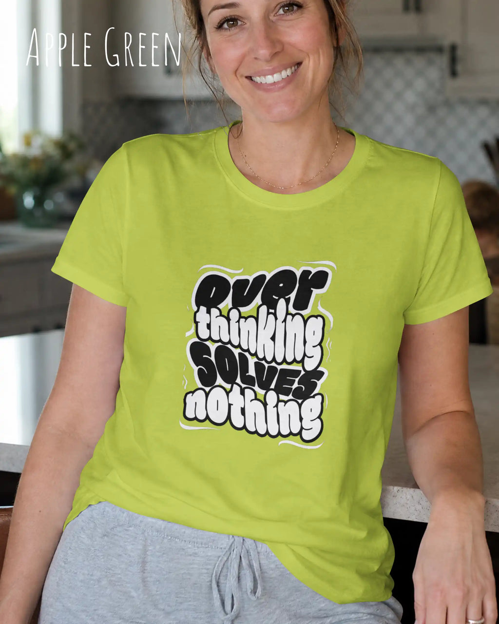 die Abbildung zeigt eine  frau, die ein damen design-t-shirt in der farbe apple green mit dem Motiv "overthinking solves nothing" trägt,