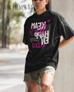 mann trägtt ein oversized heavyweight t-shirt in new reach navy mit dem design make it happen today.