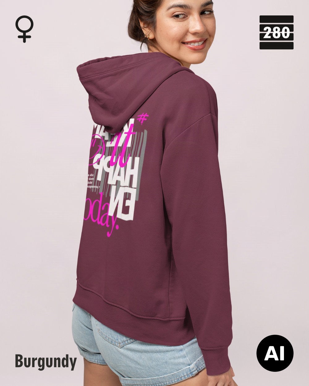 das bild zeigt eine frau, die einen leicht taillierten damen hoodie in der farbe burgundy und mit dem statement design "make it happen today" auf dem rücken trägt.