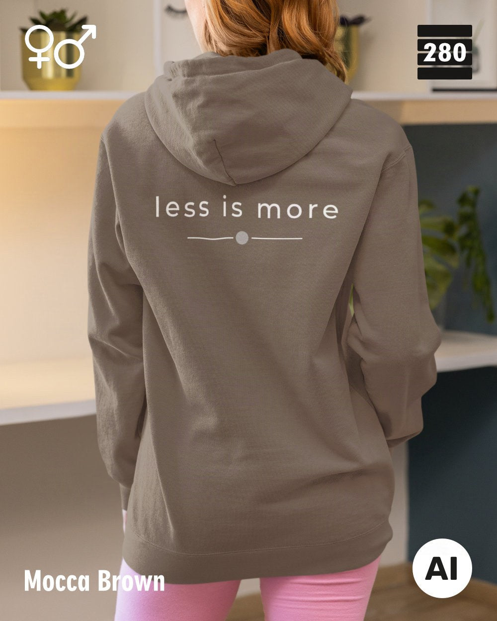 das bild zeigt eine frau, die einen unisex design hoodie in der farbe mocca brown und mit dem zeitlosen motiv "less is more" auf dem rücken trägt.