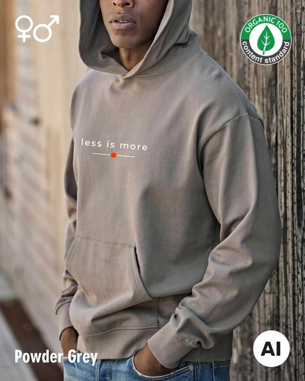 ein mann trägt einen Premium Design-Hoodie aus 100% Bio-Baumwolle in der farbe powder grey mit dem eleganten motiv "less is more" mittig auf der brust..