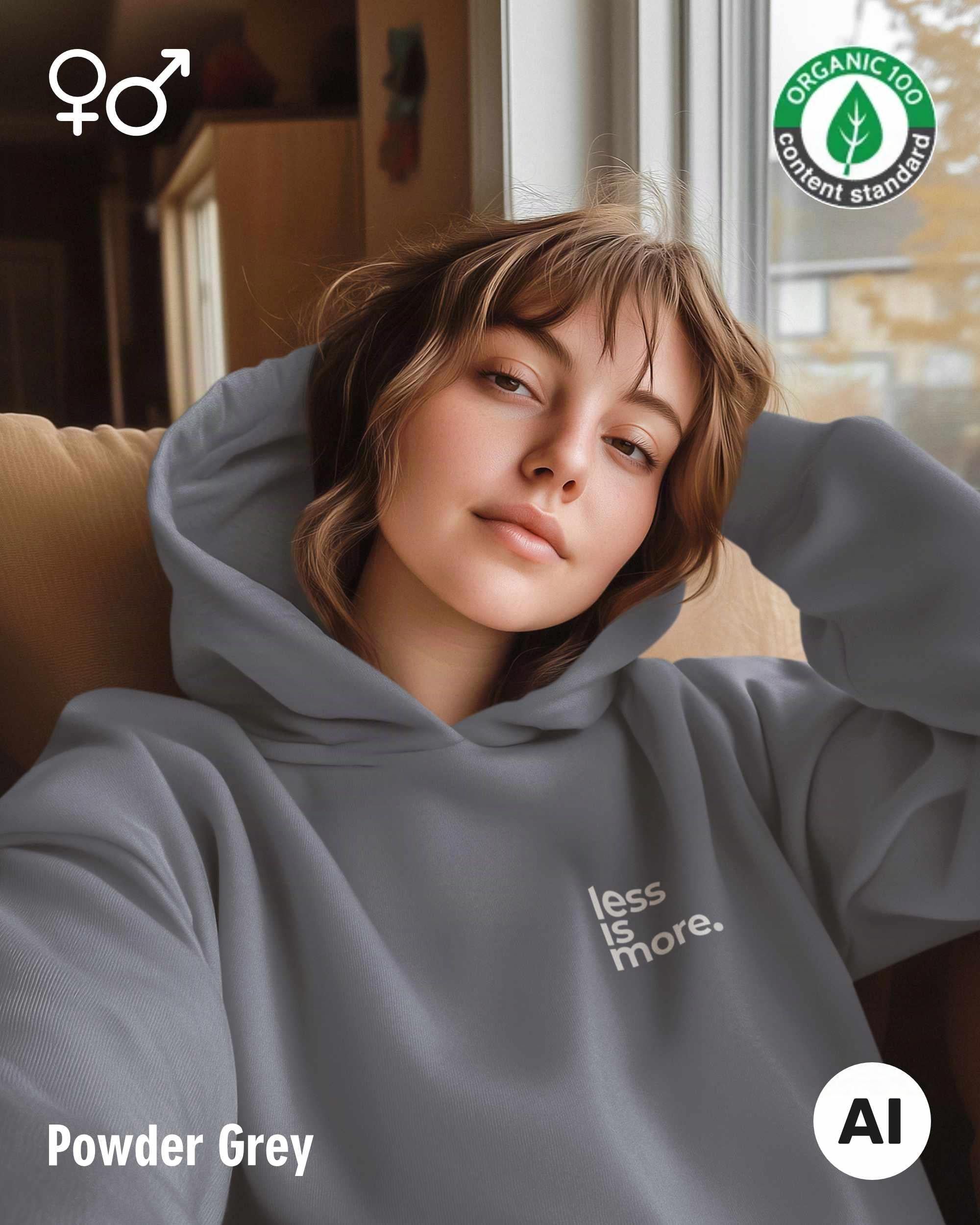 die ki-generierte Abbildung zeigt das selfie einer frau, die einen oversized Premium Design-Hoodie in der farbe powder grey mit dem minimalistischen motiv "less is more" trägt.