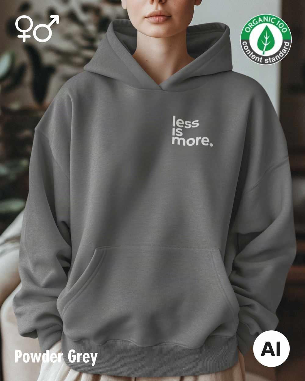 die ki-generierte Abbildung zeigt eine frau, die einen oversized Premium Design-Hoodie in der farbe powder grey mit dem minimalistischen motiv "less is more" trägt.