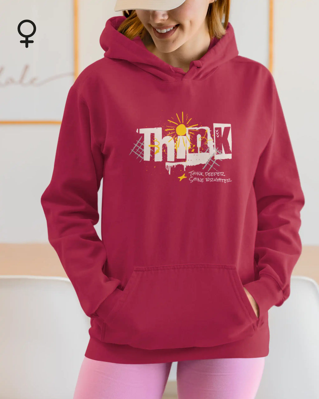 eine frau  trägt einen design-hoodie mit femininem schnitt mit der Grafik think deeper - shine brighter.