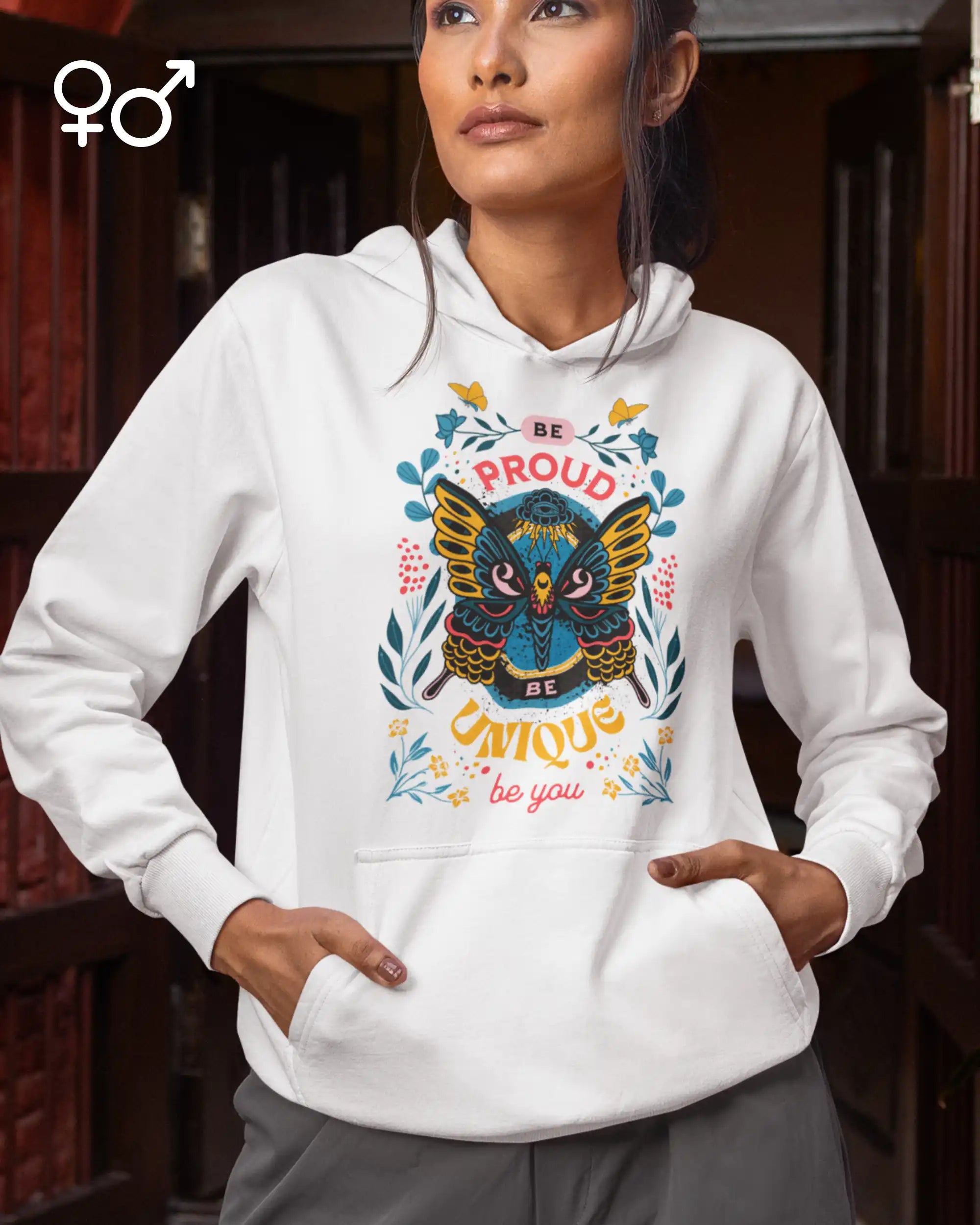 eine junge frau trägt ein enen unisex hoodie mit dem design be proud be unique be you.
