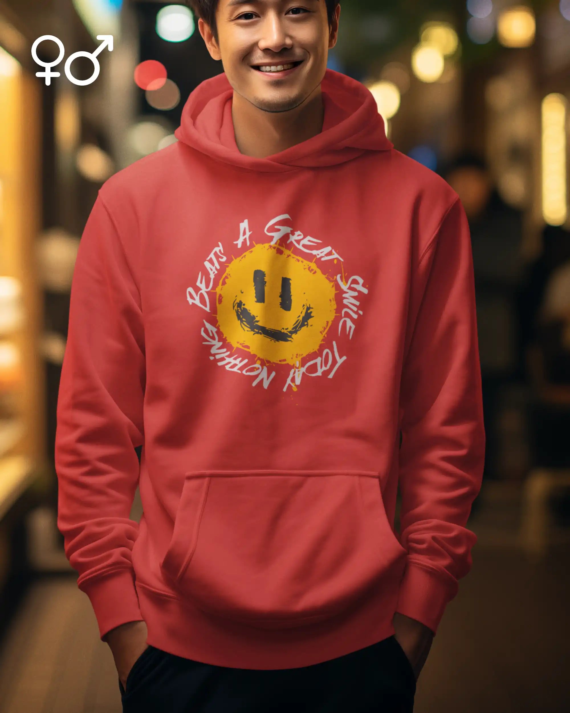 Eine lachender mann trägt einen unisex oversized  design-hoodie mit einem fröhlichen smiley-motiv.